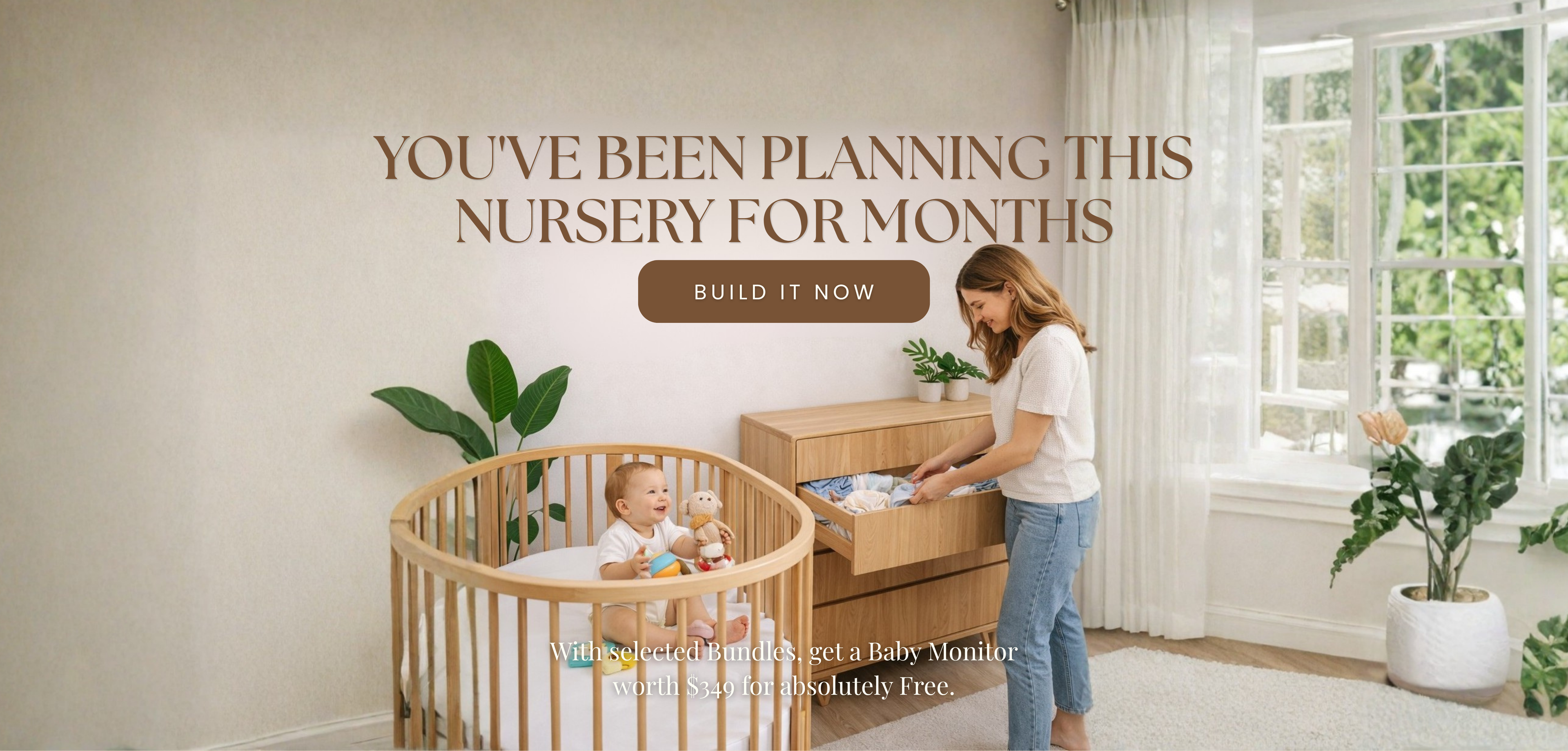 A woman stands beside a light wood crib with a baby inside in a bright nursery, next to a wooden dresser. Large text on the wall reads, 'YOU'VE BEEN PLANNING THIS NURSERY FOR MONTHS BUILD IT NOW.