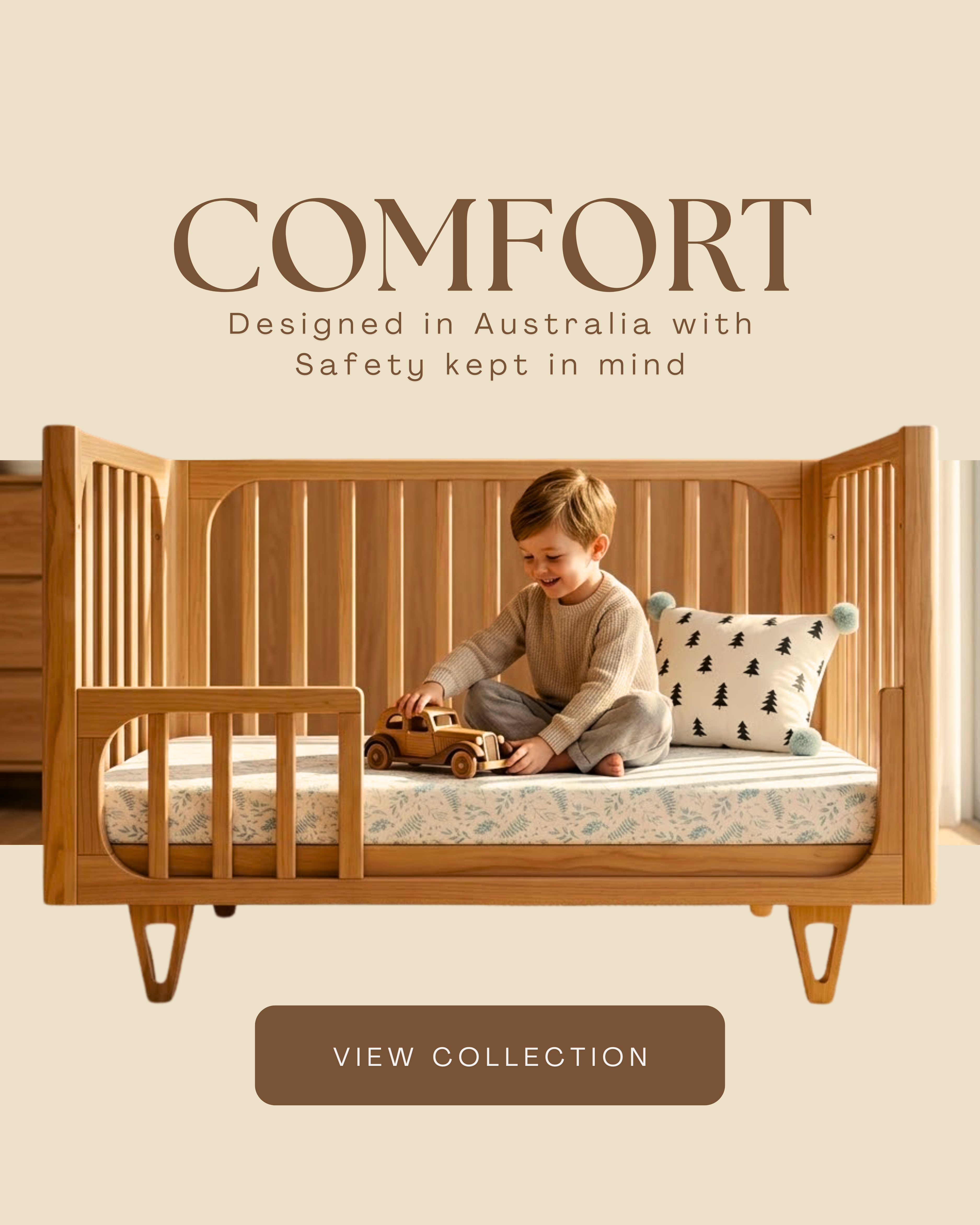Toddler sitting and playing with a wooden toy car on a Cocoon Piccolo cot converted to toddler bed with a patterned fitted sheet — Cocoon nursery furniture designed in Australia with safety in mind.